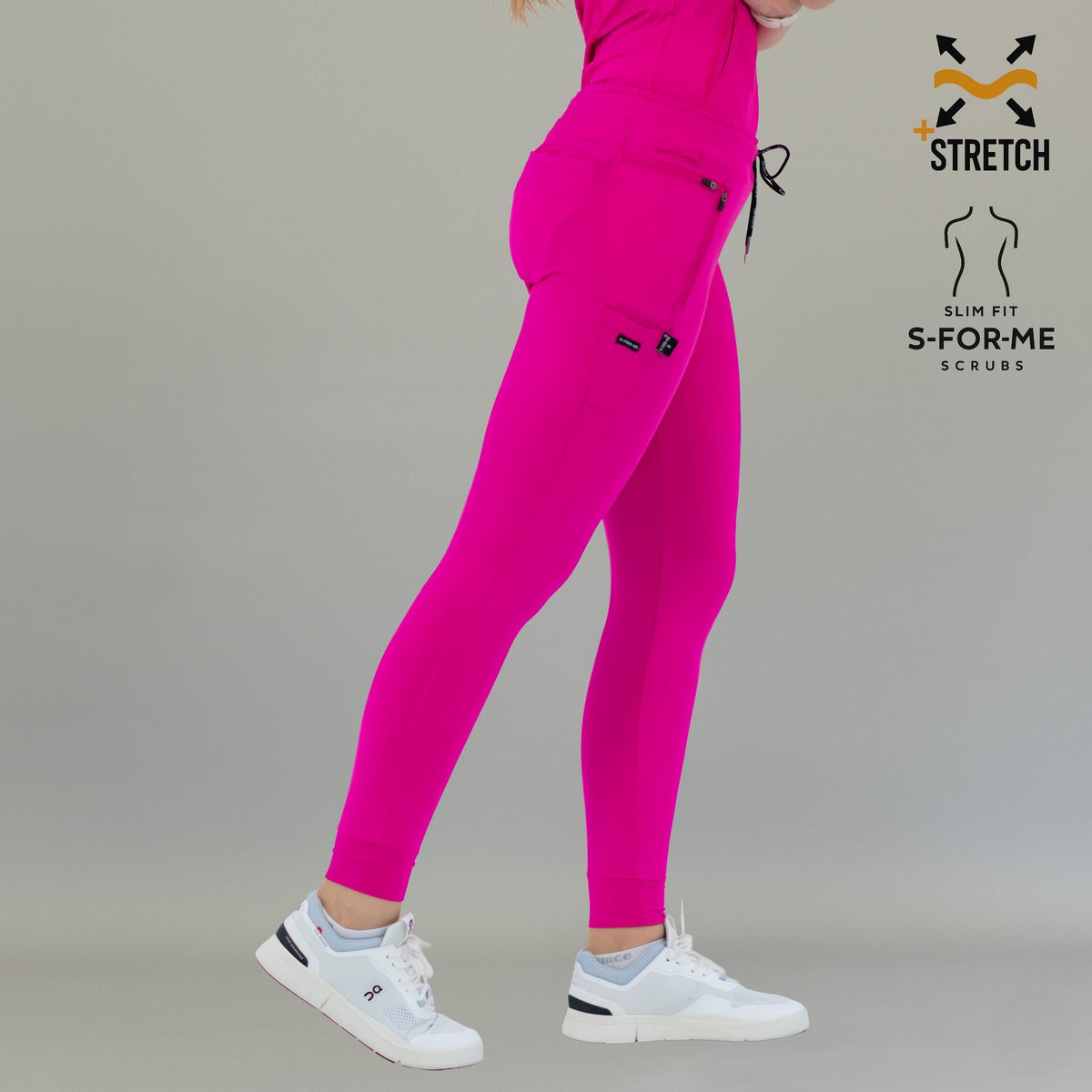 Three-quarter side view of fuchsia Women's Jogger Pants 920 walking forward.