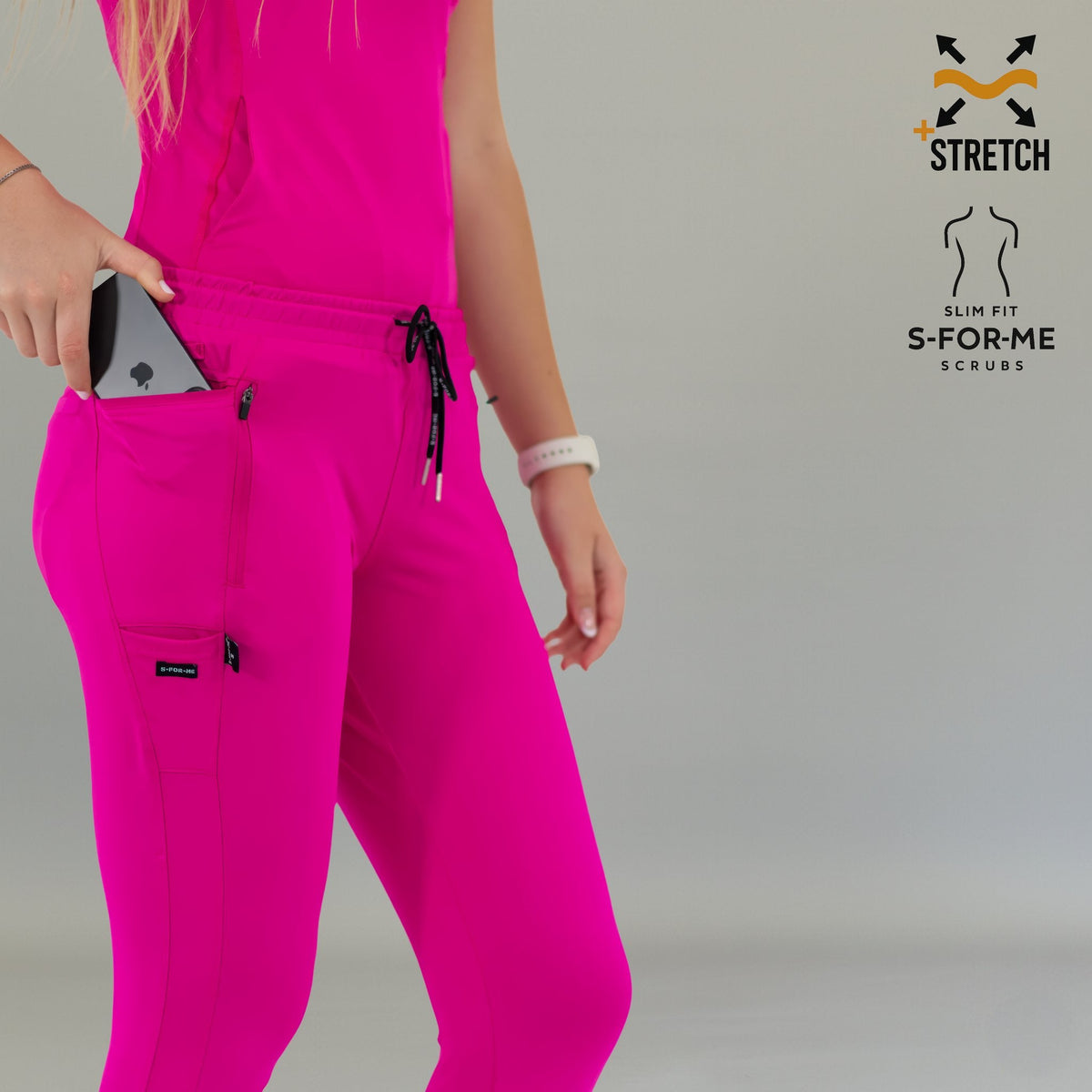 Close-up of fuchsia Women's Joggers Pants 920 showing side pocket with a phone.