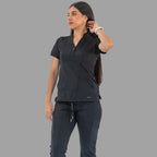 Women's black Style 930 scrub top, front view with hand in hair