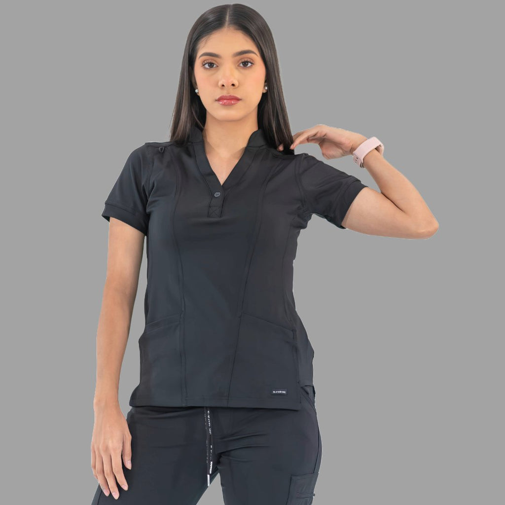Women's black Style 930 scrub top, front view with hand on shoulder